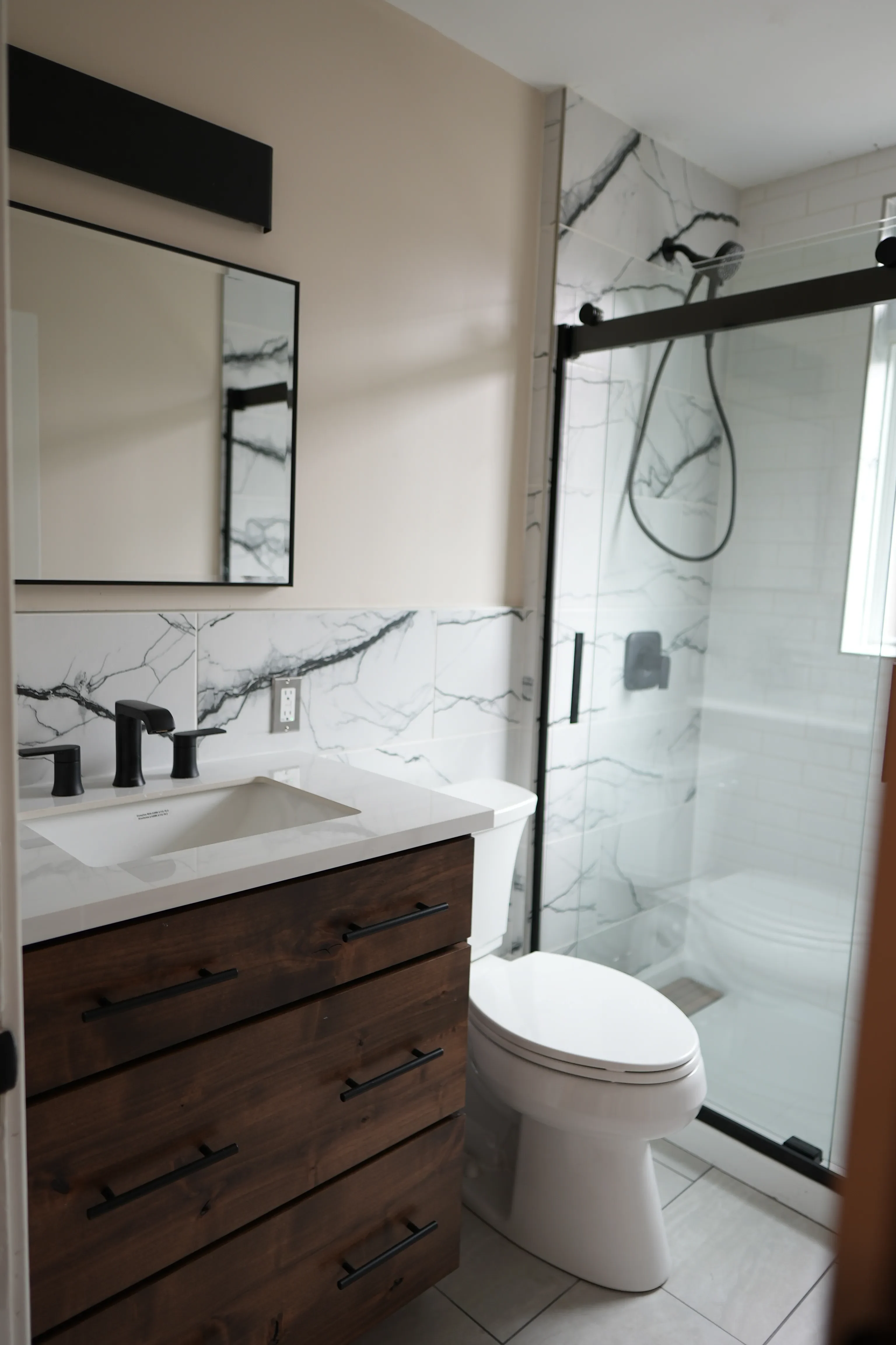 Marble-tiled bathroom at 204 E Oakland