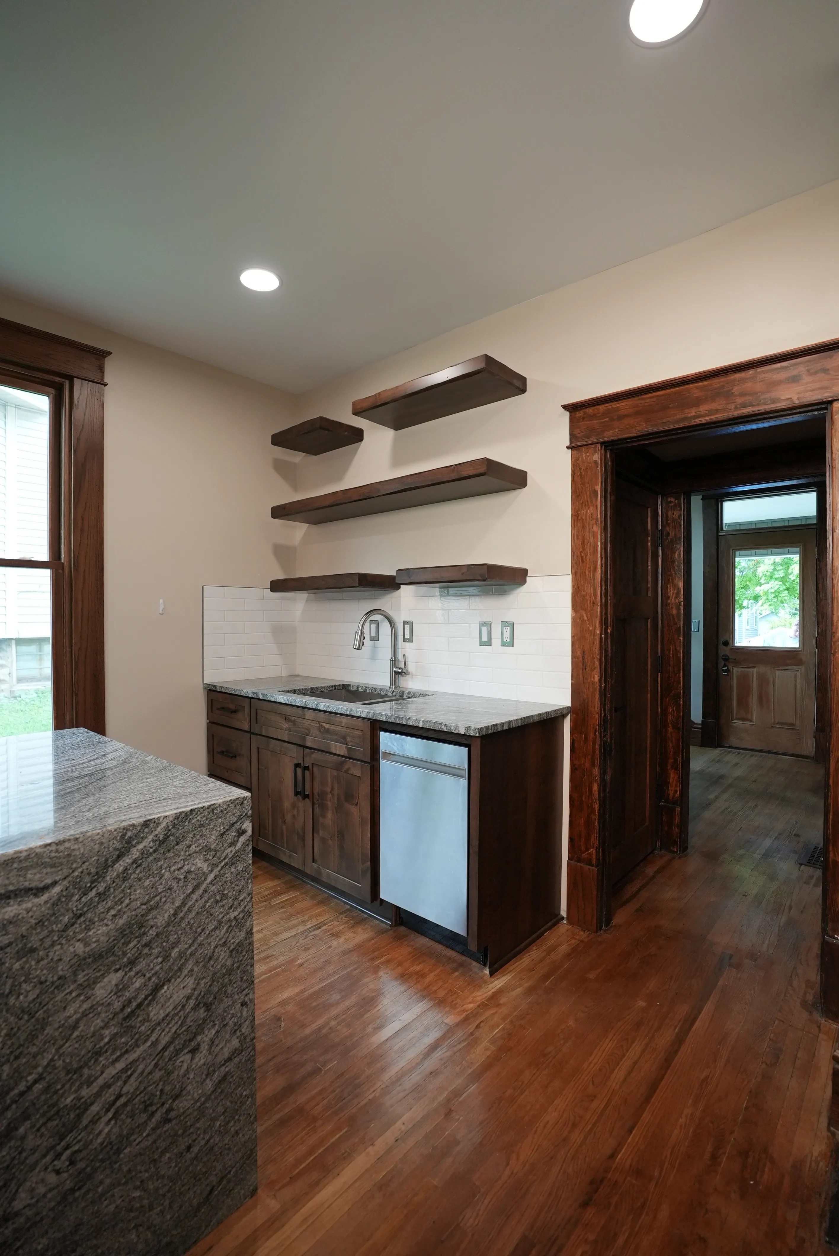 Kitchen with floating shelves at 204 E Oakland